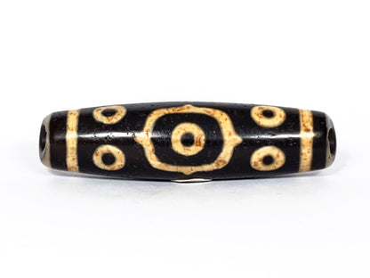 V-FA-062126-14E-LK dzi bead, close side profile showing octagonal-framed eye detail, unretouched