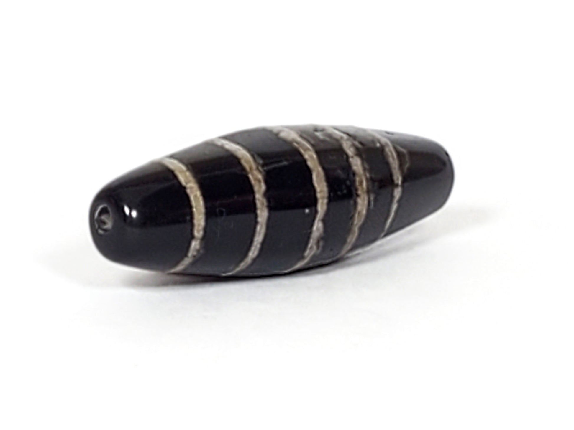 At-062626-9SChung Bead B side view, stripe texture, age-weathered edges, deep black agate, unretouched