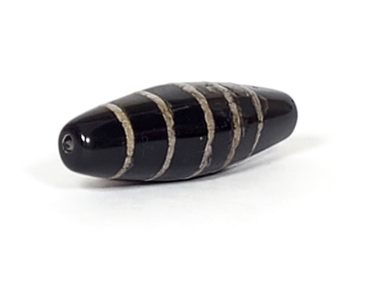 Antique nine stripe Chung dzi bead, black agate with white striping and natural patina, drilled hole visible