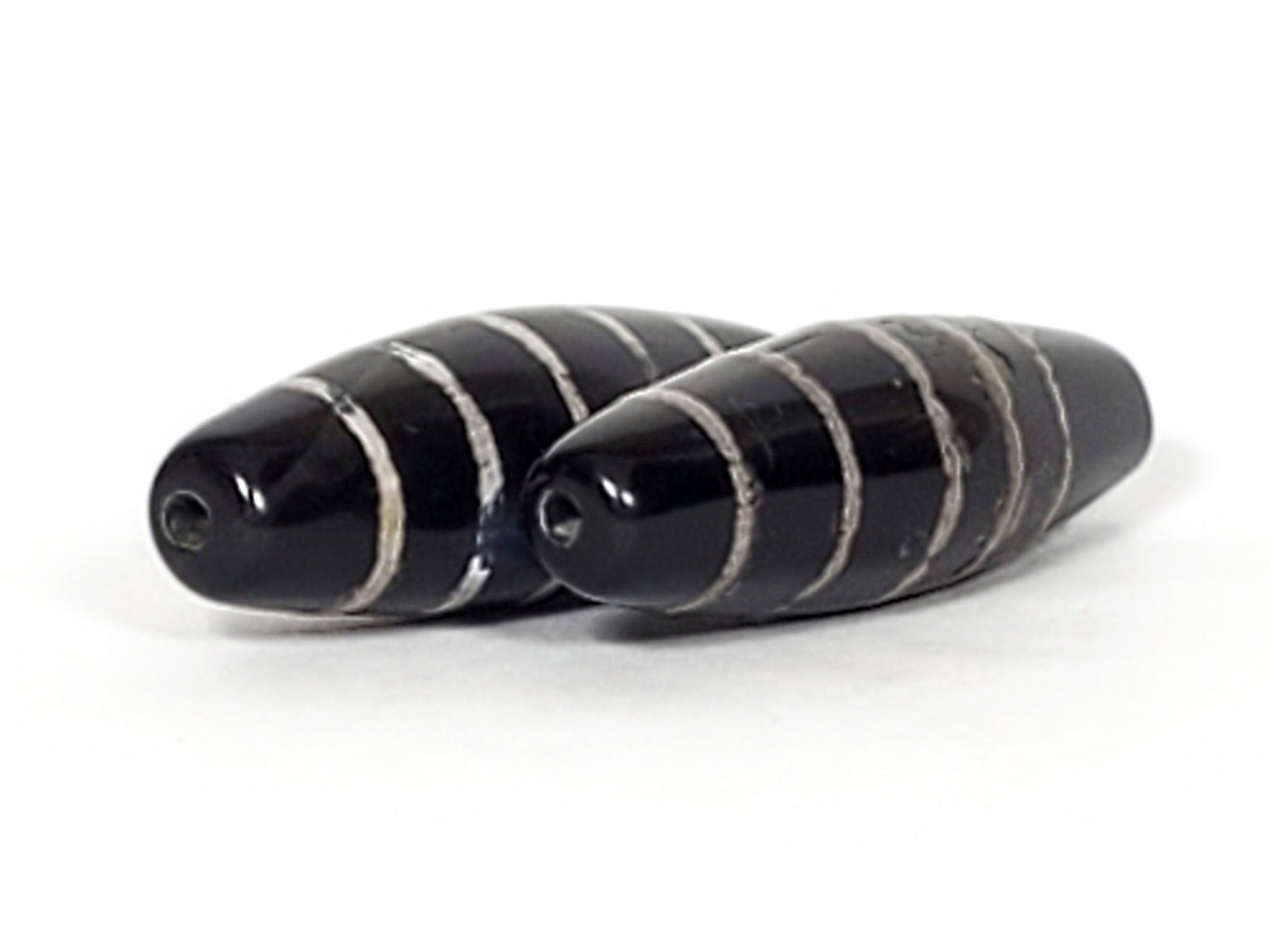 At-062626-9SChung pair nine stripe Chung dzi together, drill ends visible, black agate, unretouched