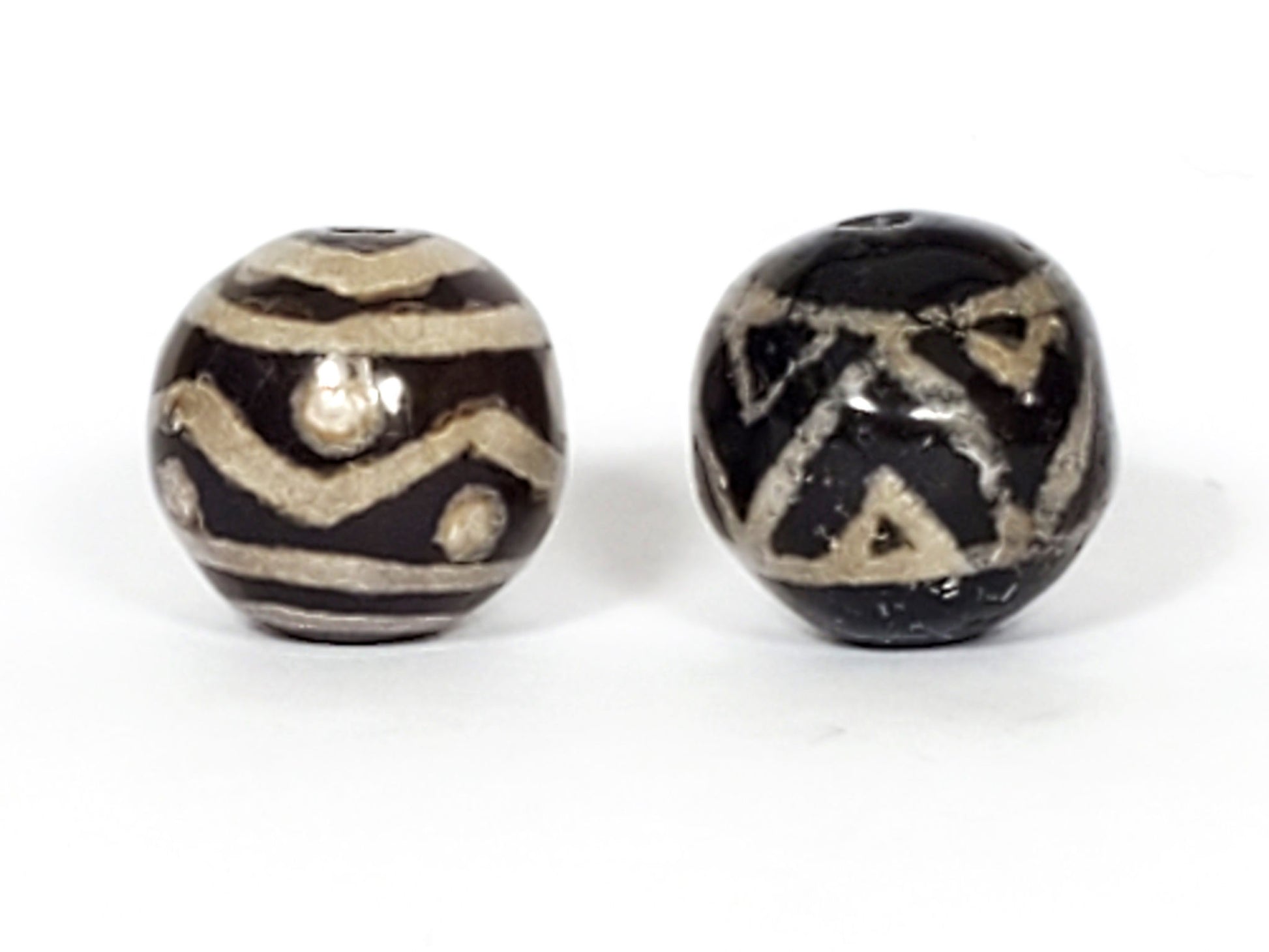 V-FA-062526-TSWS-TT pair faux-antique round dzi, second side view, Bead A wave chevron, Bead B angular elements, unretouched