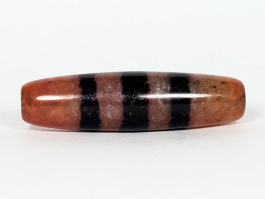 At-070622-5SChung, 48.2×13.1mm five stripe Chung dzi, terracotta reddish-brown ground, wide pitch-black stripes, unretouched