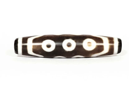 N-062426-10E new ten eye dzi 58.5x13.4mm Face A three eyes in row two-tone warm brown ground cream motif unretouched