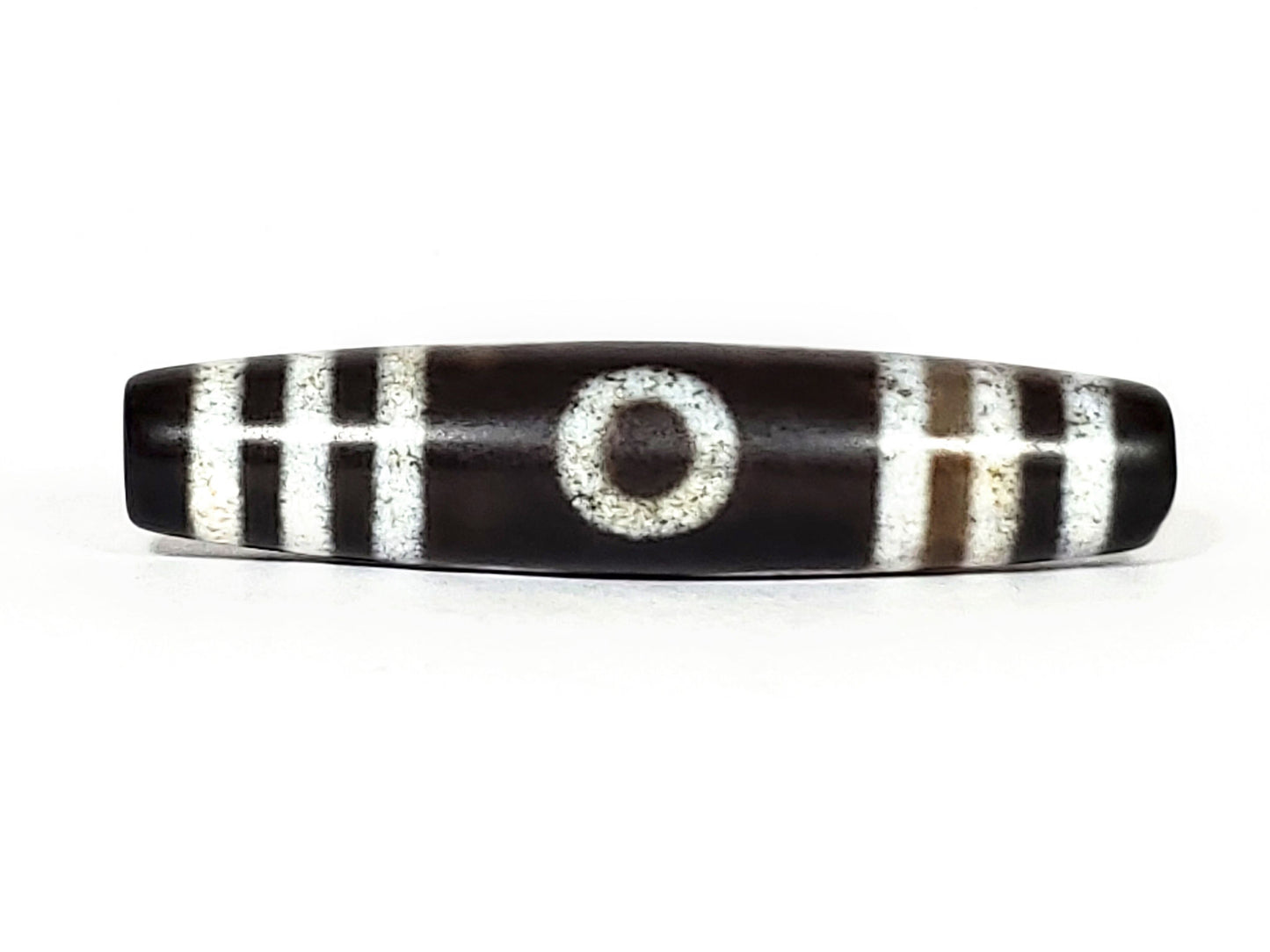 N-062426-3E new three eye dzi 58.6x13.4mm Face A single central eye dark to near-black ground cream motif unretouched