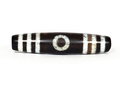N-062426-3E2 new three eye dzi 57.9x13.3mm Face A single eye near-black ground warm rust-brown agate banding unretouched