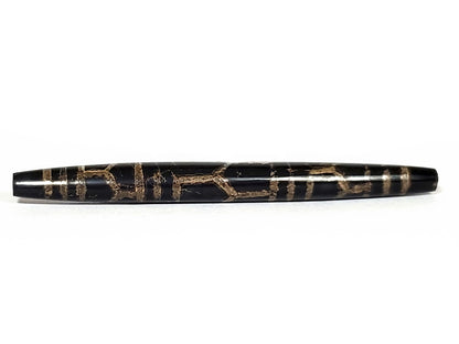 Ac-062926-3LG opposite end angled view, full taper visible, triple longevity pattern, pitch-black agate, unretouched