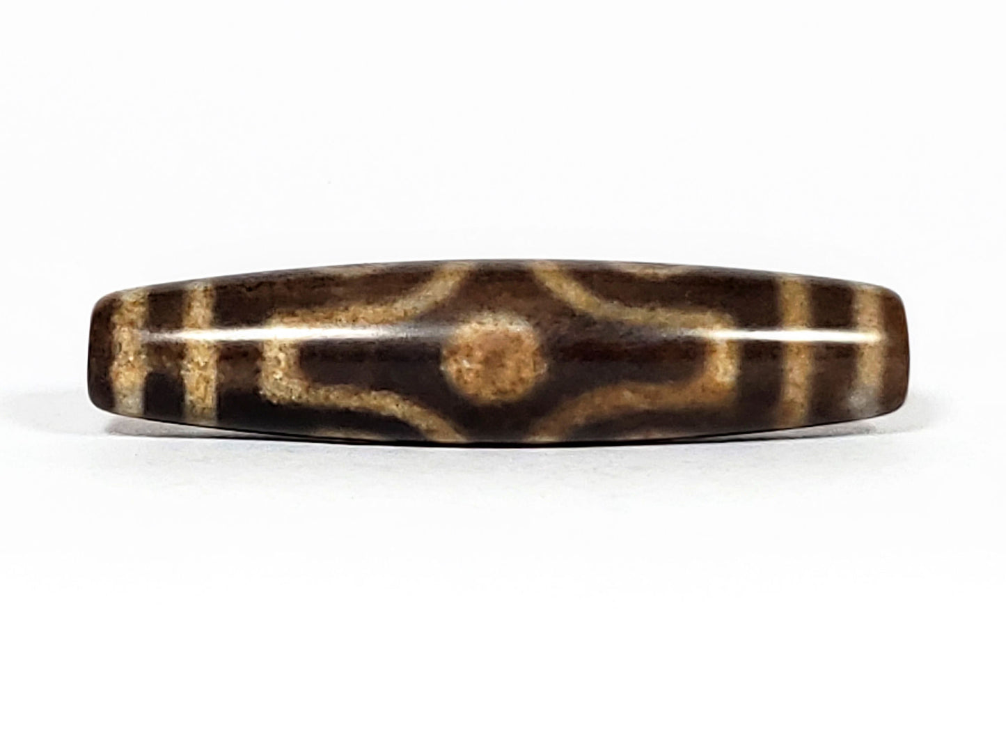 N-062226-6E2, six eye agate dzi, 58.2×13.4mm, medium warm brown, honey-gold motif lines, face A, unretouched