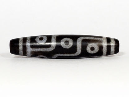 N-062226-9E, nine eye agate dzi, 57.7×12.9mm, deep cool grey-black, silvery-grey motif, face A, unretouched