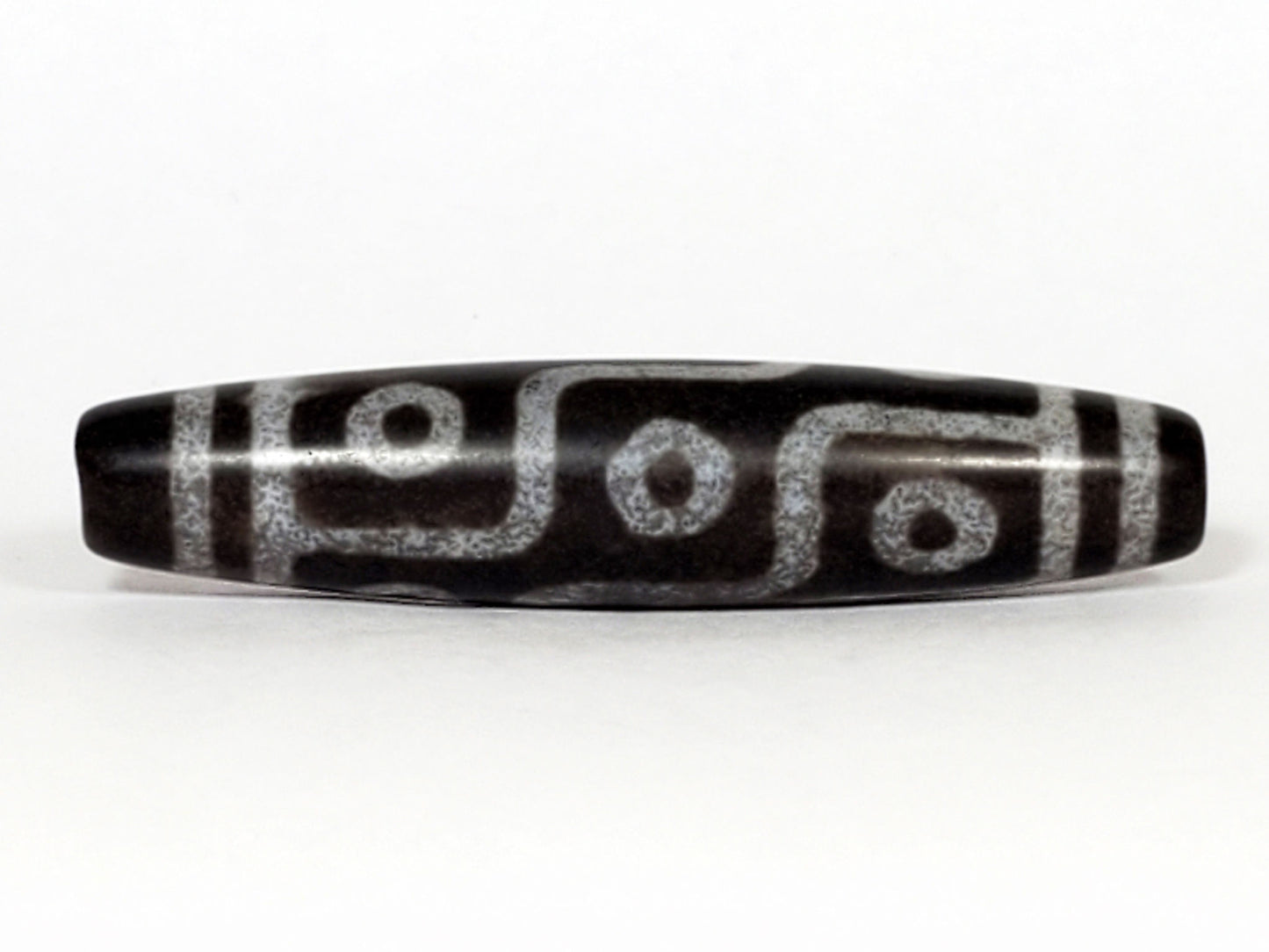 N-062226-9E, face B, nine eye flowing curved-line motif, cool grey-black ground, pale silvery-grey lines, unretouched
