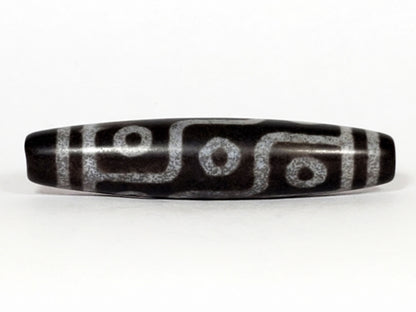 N-062226-9E, face B, nine eye flowing curved-line motif, cool grey-black ground, pale silvery-grey lines, unretouched