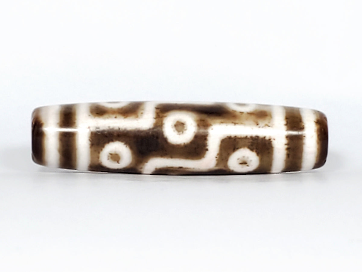 Antique nine-eye Dzi bead, brown agate, white eye motifs, etched zigzag lines, aged patina, Qing Dynasty Tibetan/Chinese