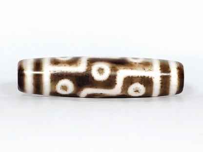 Antique nine-eye Dzi bead, brown agate, white eye motifs, etched zigzag lines, aged patina, Qing Dynasty Tibetan/Chinese