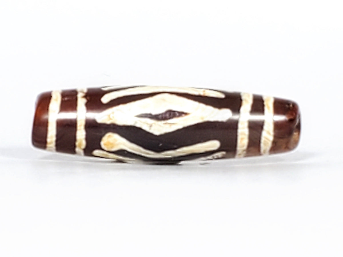 Antique carnelian dzi bead two diamond eye tiger tooth motif white etched pattern brown agate patina oval barrel shape