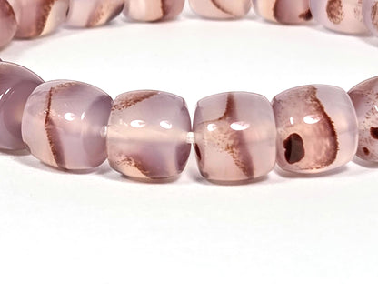 N-030526-CB2 close-up, dark brown-red cinnabar cluster mass in dusty mauve-rose chalcedony, gold spacers, unretouched