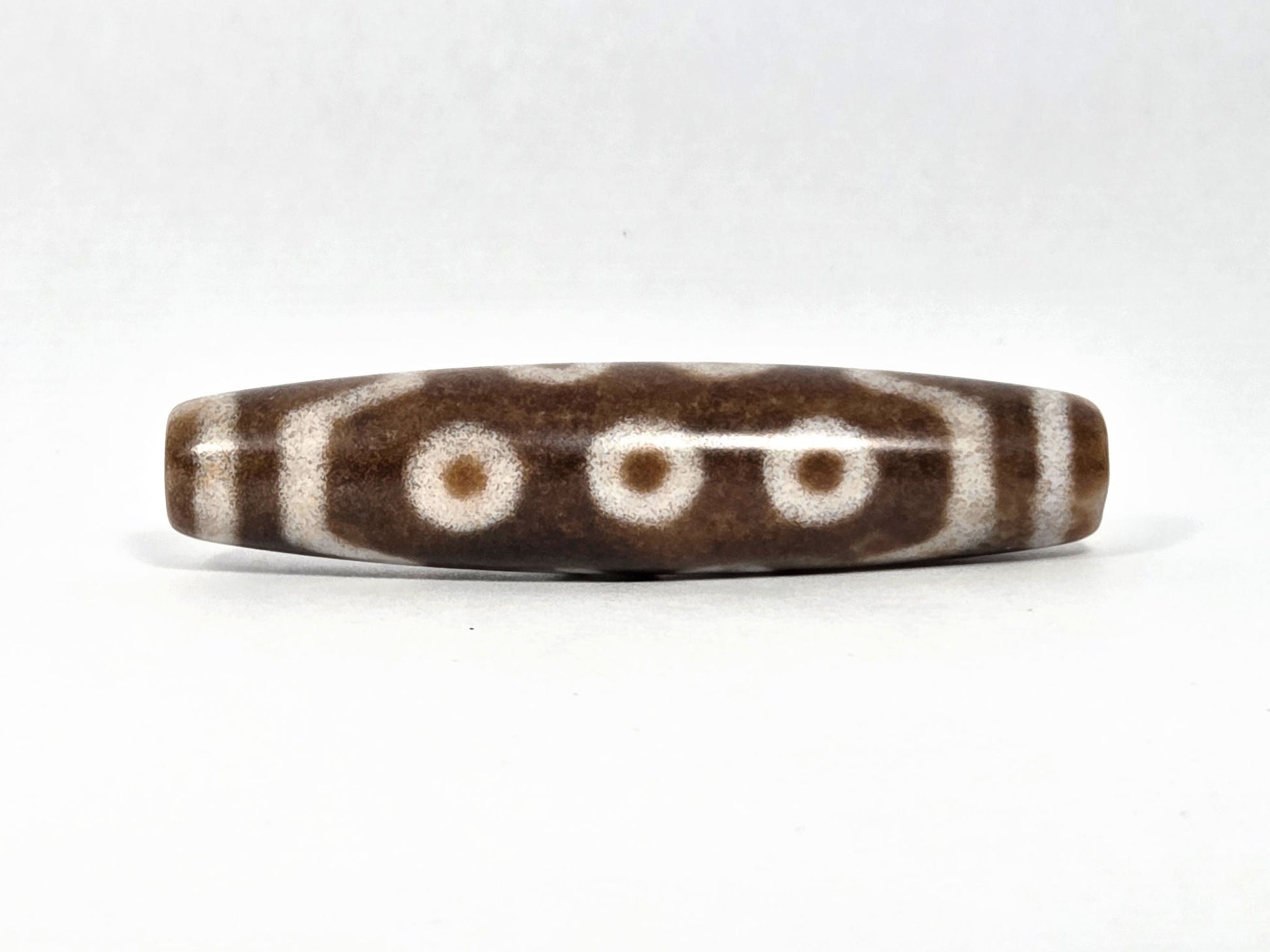 N-083126-10E new ten eye dzi bead 58.3x13.4mm warm brown agate matte front face unretouched