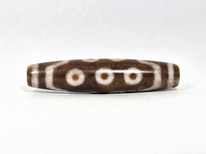 N-083126-10E new ten eye dzi bead 58.3x13.4mm warm brown agate matte front face unretouched