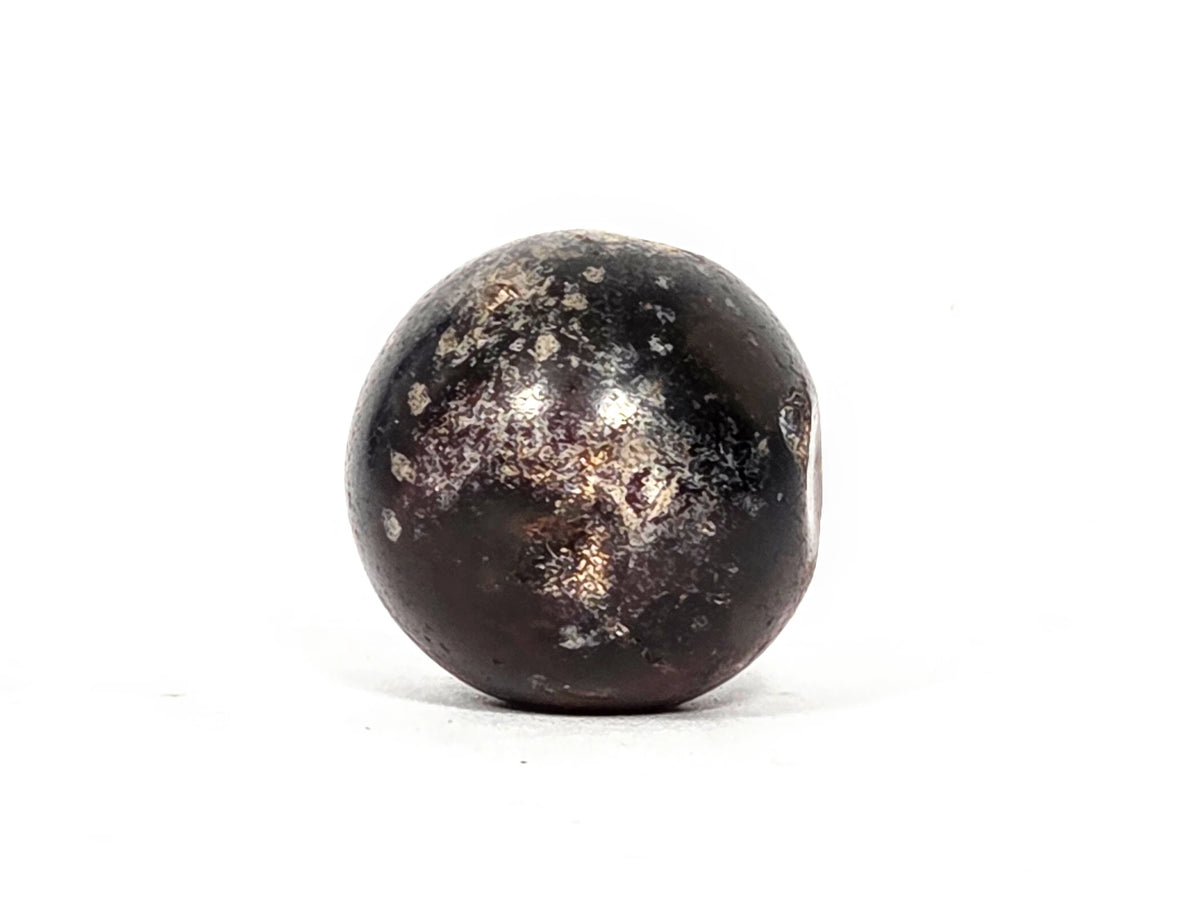 Third profile view of ancient round agate bead AC-101126-RS showing full near-spherical form, two-tone dark brown and reddish-brown agate coloring, and natural mineral spot inclusions