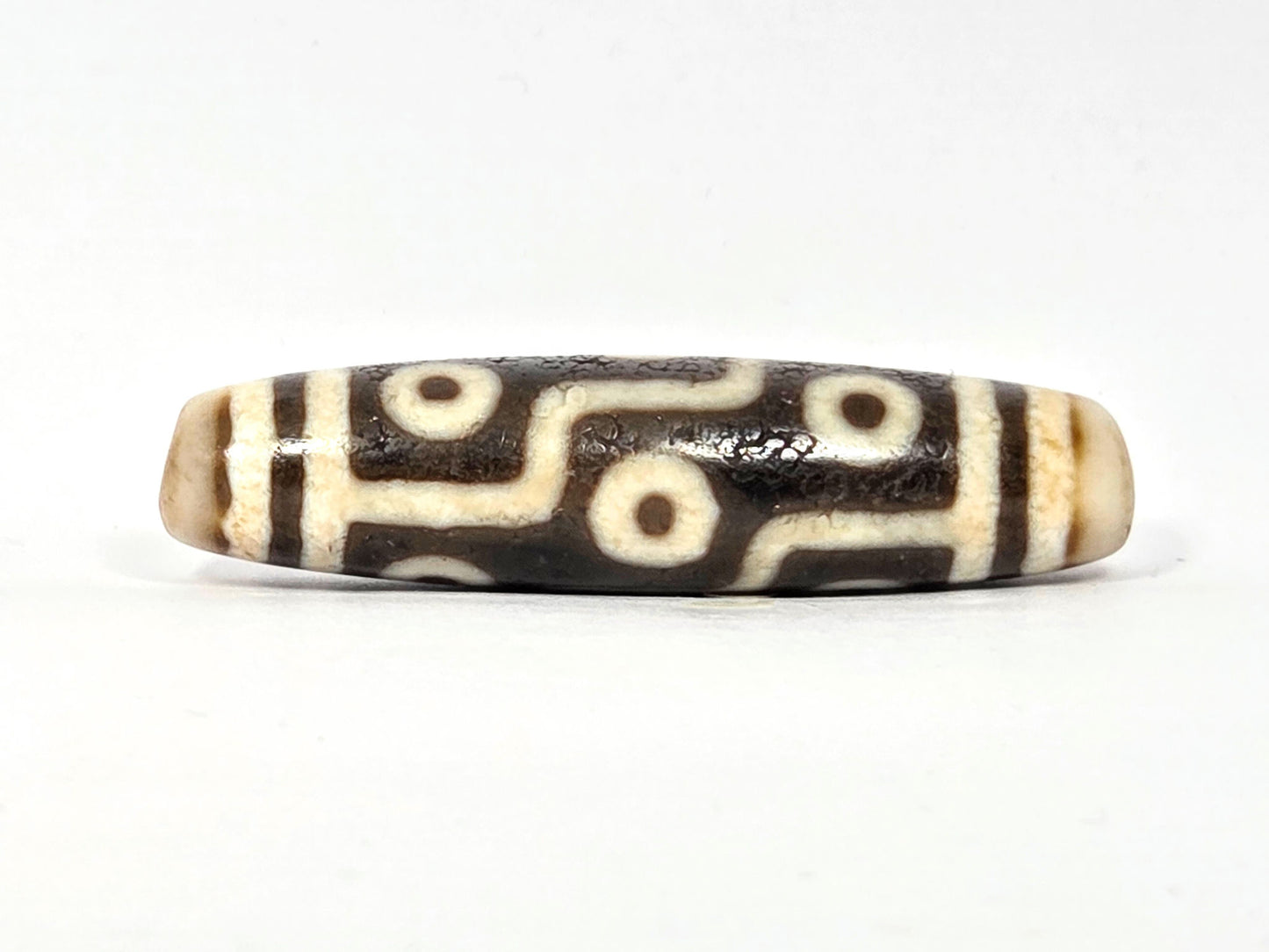 Rotated second face of ancient Nine Eye Dzi bead — nine eye circles on rare cream white agate, bold brown-black etching, 54mm, ~800 years old