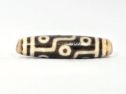 Rotated second face of ancient Nine Eye Dzi bead — nine eye circles on rare cream white agate, bold brown-black etching, 54mm, ~800 years old