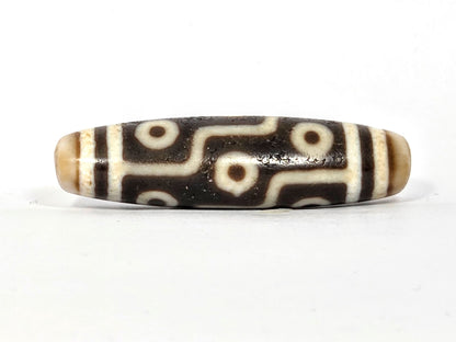 Third angle of ancient Nine Eye Tibetan Dzi bead — all nine eye circles visible across 54mm rare white agate body, genuine ancient Tibetan amulet