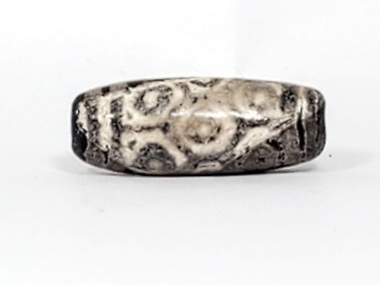 Ancient Twelve Eye Lotus Dzi, 27.8mm — heavily calcified black agate, 1,500–2,000 years old