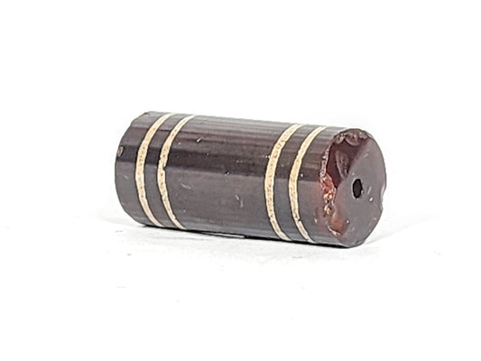 Ac-061426-4Str, four stripe agate dzi, 32.3×14.3mm, deep cool grey-brown barrel, right-end chip, unretouched