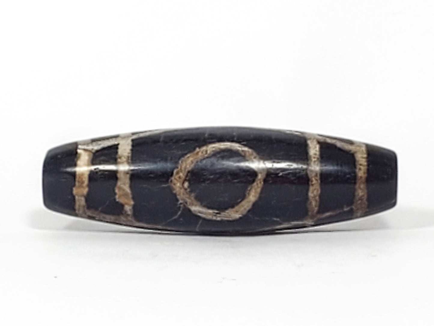 Second side of ancient Two Eye Dzi bead — cream and tan calcification against deep black natural agate, 45.1mm