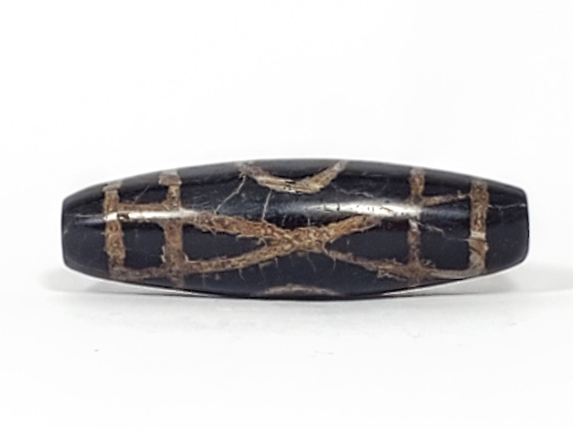 Third angle of 1,500–2,000 year old ancient Two Eye Dzi bead — profile showing calcification distribution across full body