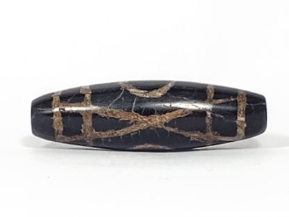 Third angle of 1,500–2,000 year old ancient Two Eye Dzi bead — profile showing calcification distribution across full body