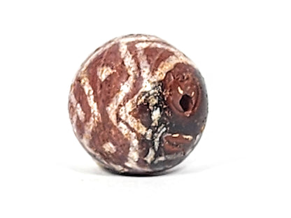 Ac-122224-TSS face B, tiger stripe chevrons legible, moderate calcification, reddish-brown carnelian sphere, unretouched