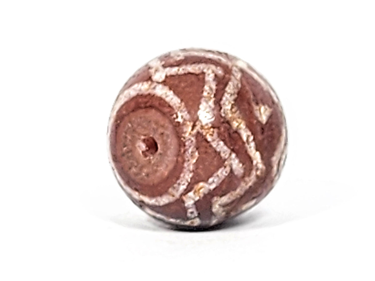 Ac-122224-TSS face C, star asterisk crossing motif centre zone, tiger stripe surround, calcification, unretouched