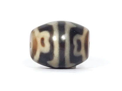 At-061826-RTTL antique tiger tooth lotus dzi near-sphere 25.4×20.1mm dark grey-brown, cream-white motif, unretouched
