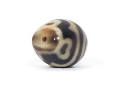 At-061826-RTTL drill hole pole, warm honey-brown tip, fine well-centred drill hole, mirror-gloss surface, unretouched