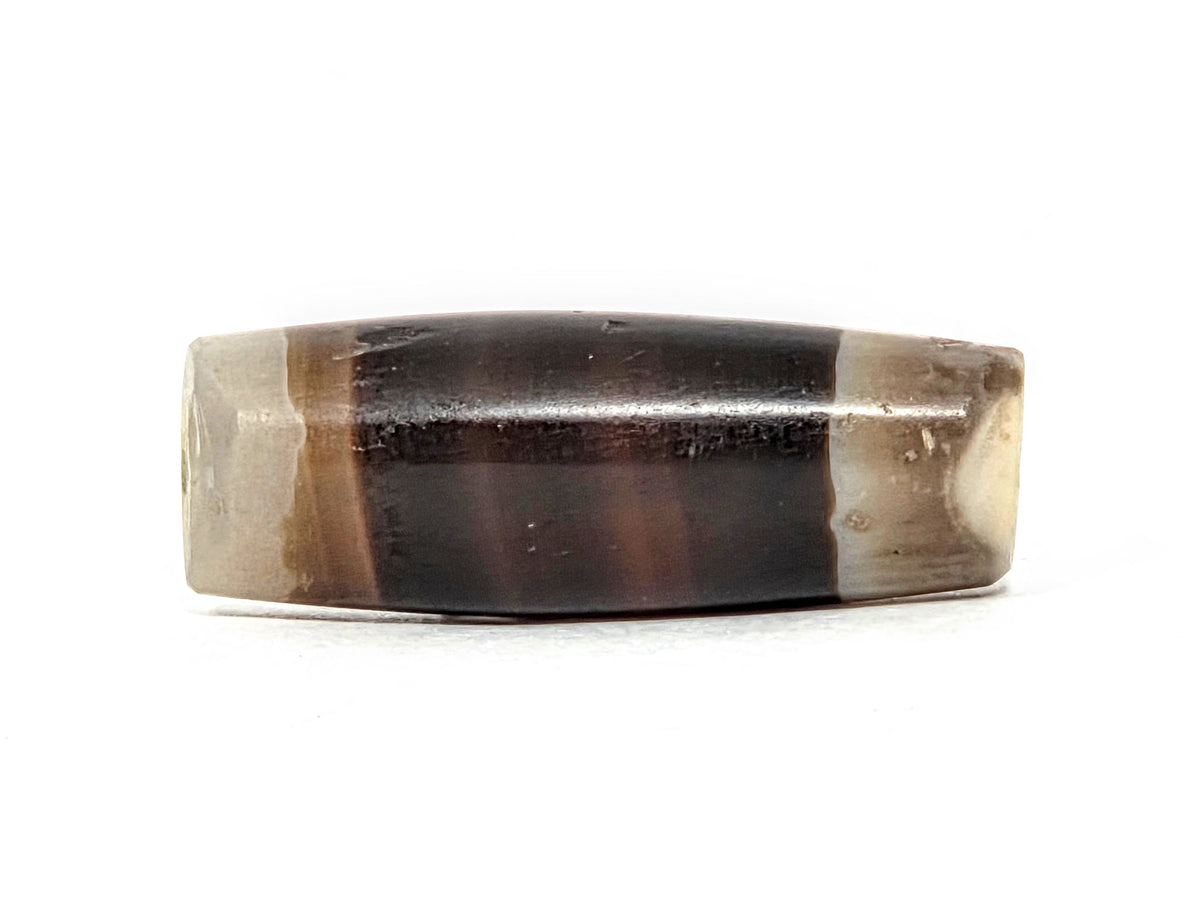 Ac-061526-1SBW, right end 3/4 view, medicine dig percussive damage, drill hole, honey-brown transition zone, unretouched