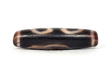 Ac-030525-3E lower connector face, warm reddish-brown wave band, pitch-black ground, matte weathered surface, unretouched