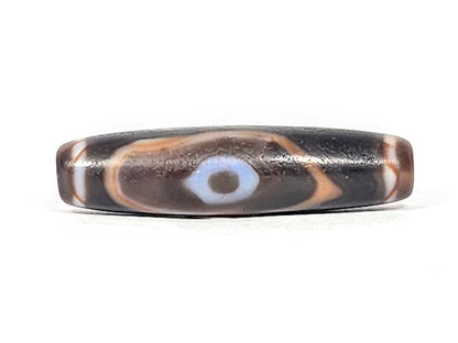 Ac-030525-3E ancient three eye dzi 50.8×12.9mm pitch-black, two honey-orange inner ring eyes Face A, unretouched