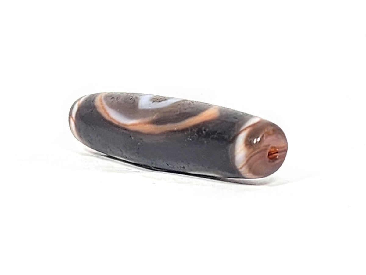 Ac-030525-3E left drill hole end, warm terracotta-orange interior, chocolate-brown end cap, body micro-texture, unretouched