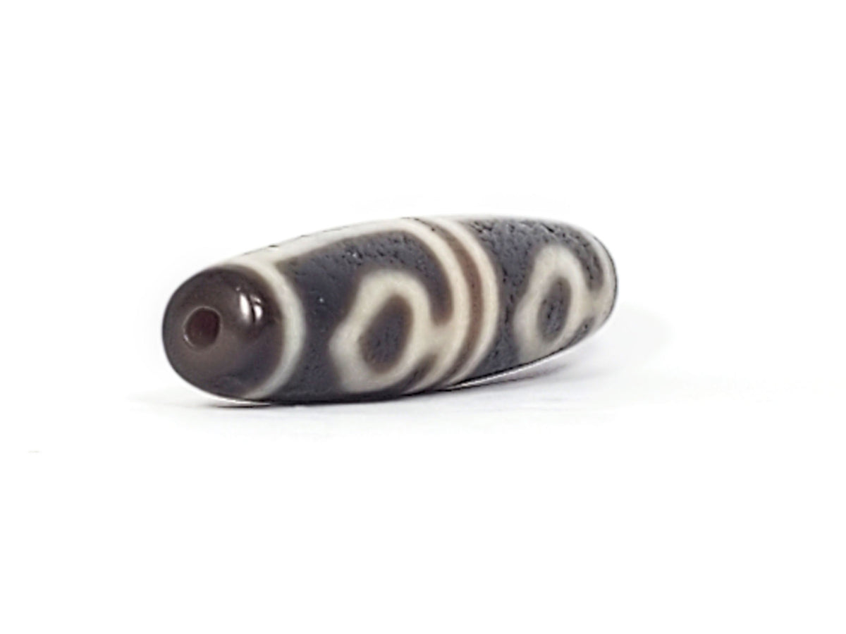 Ac-061826-FLB2 right drill hole end, warm reddish-brown interior, bodhi leaf forms wrapping body, unretouched