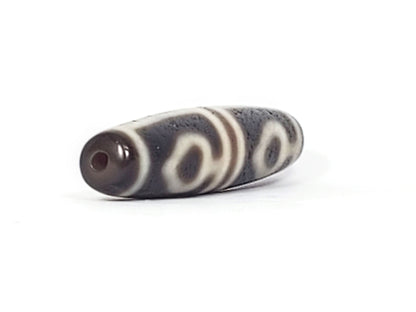 Ac-061826-FLB2 right drill hole end, warm reddish-brown interior, bodhi leaf forms wrapping body, unretouched