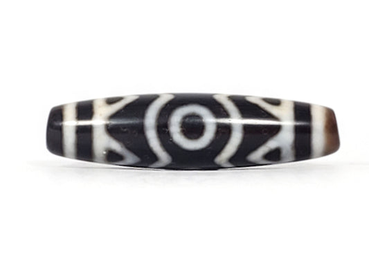 At-070926-3ETTBS antique three eye tiger tooth dzi angled view left drill end pitch-black body profile unretouched