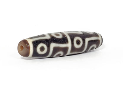 Ac-061826-12E2 angled view tip A, elongated fusiform form, clean drill hole, unretouched