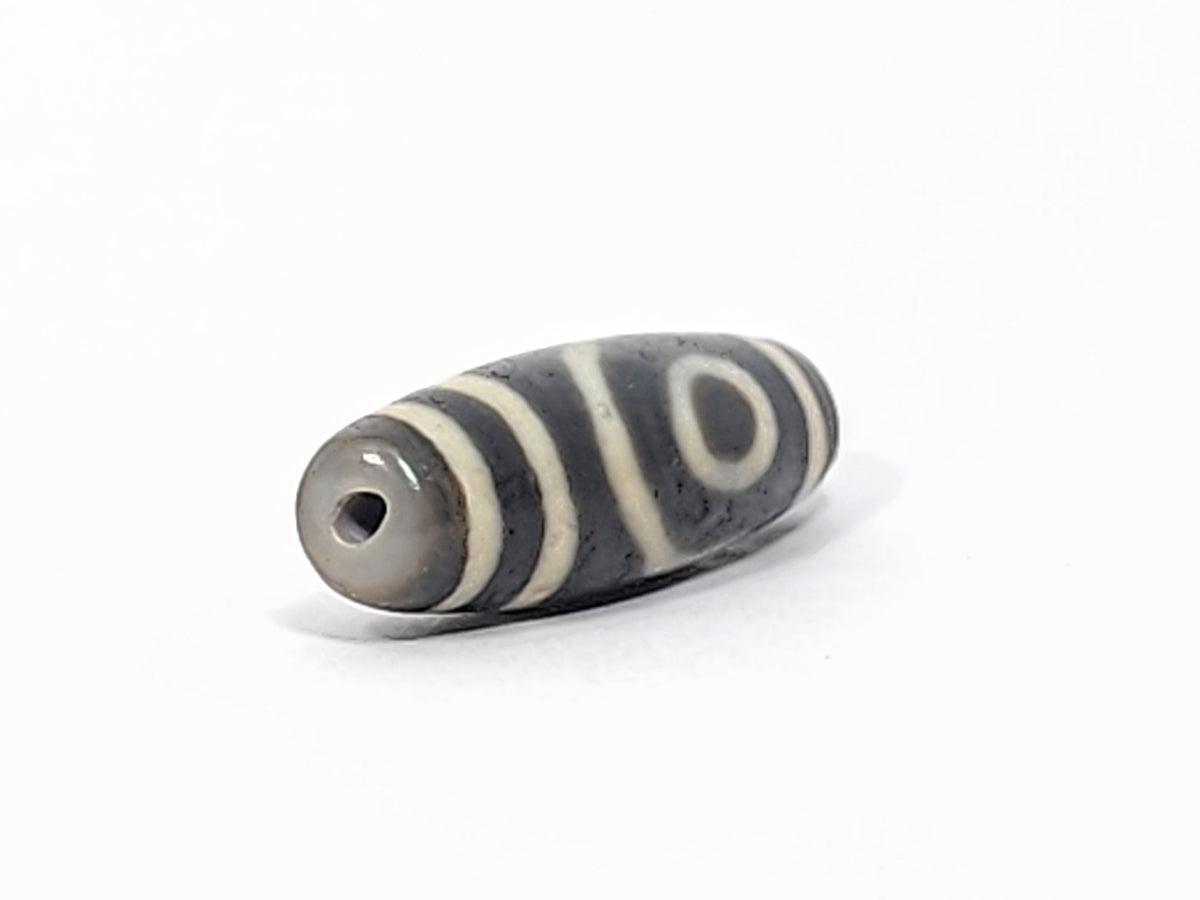 Ac-052525-2E right drill hole end, cool grey end cap and interior, spiral eye wrapping body, matte surface, unretouched