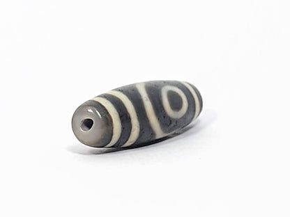 Ac-052525-2E right drill hole end, cool grey end cap and interior, spiral eye wrapping body, matte surface, unretouched