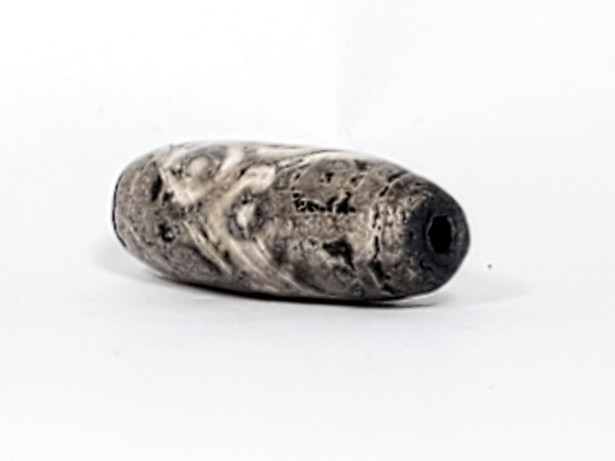 Ac-071026-12EL ancient twelve eye lotus dzi angled drill end B pitch-black interior calcification wrap unretouched
