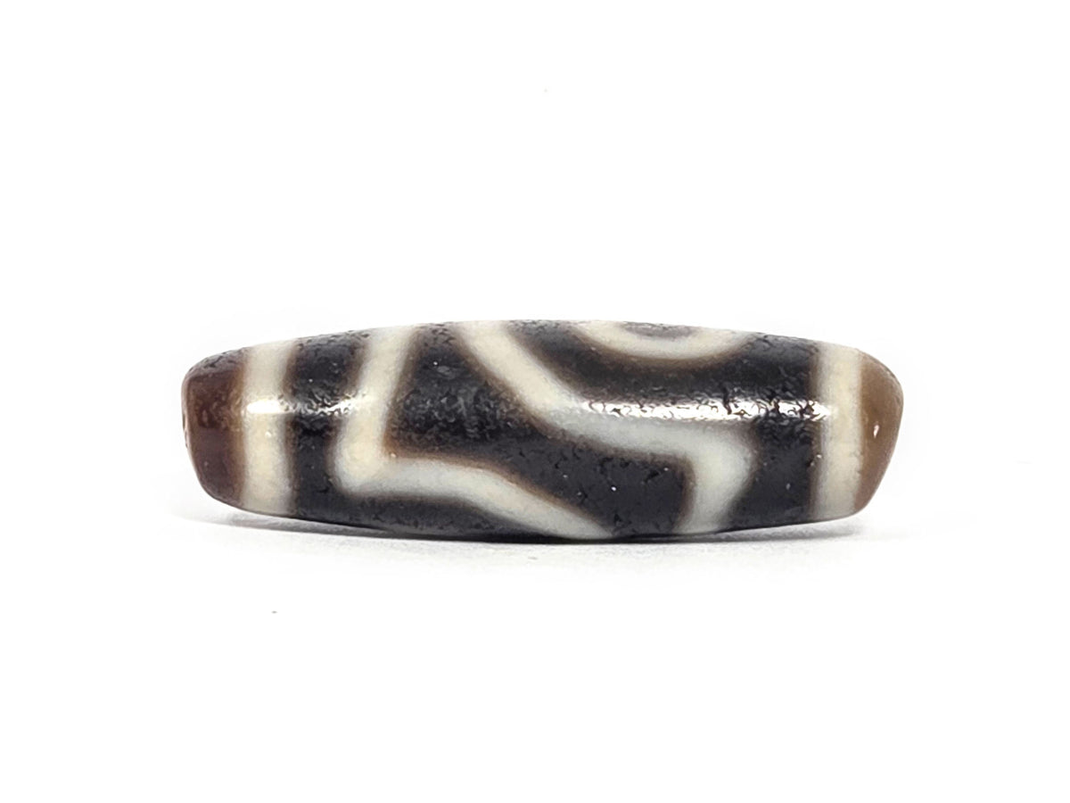 Ac-073026-2E ancient two eye dzi pitch-black agate face B second eye both drill holes visible unretouched
