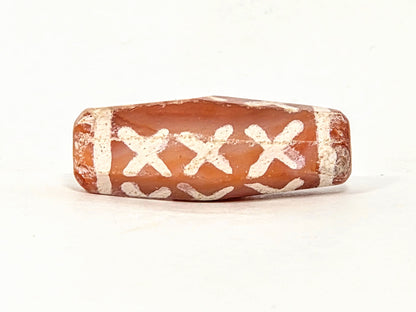 Ac-062426-12X ancient twelve X-cross carnelian dzi 28.5x11.0mm third face worn right end cap disclosed unretouched
