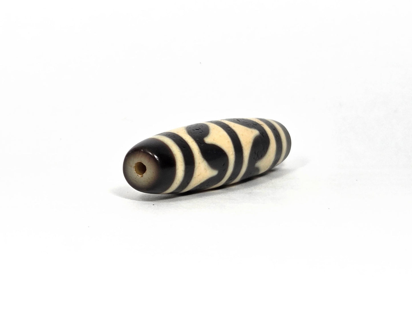 At-090226-DW8 antique double wave dzi cream black agate angled opposite drill end wave detail, unretouched