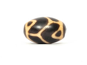 Antique Tibetan Round Dzi Bead featuring the Tiger Tooth Longevity Motif (110525)