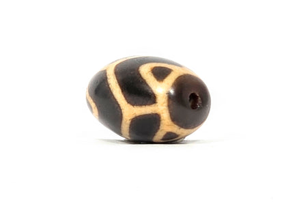 Antique Tibetan Round Dzi Bead featuring the Tiger Tooth Longevity Motif (110525)