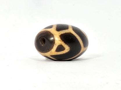 Antique Tibetan Round Dzi Bead featuring the Tiger Tooth Longevity Motif (110525)